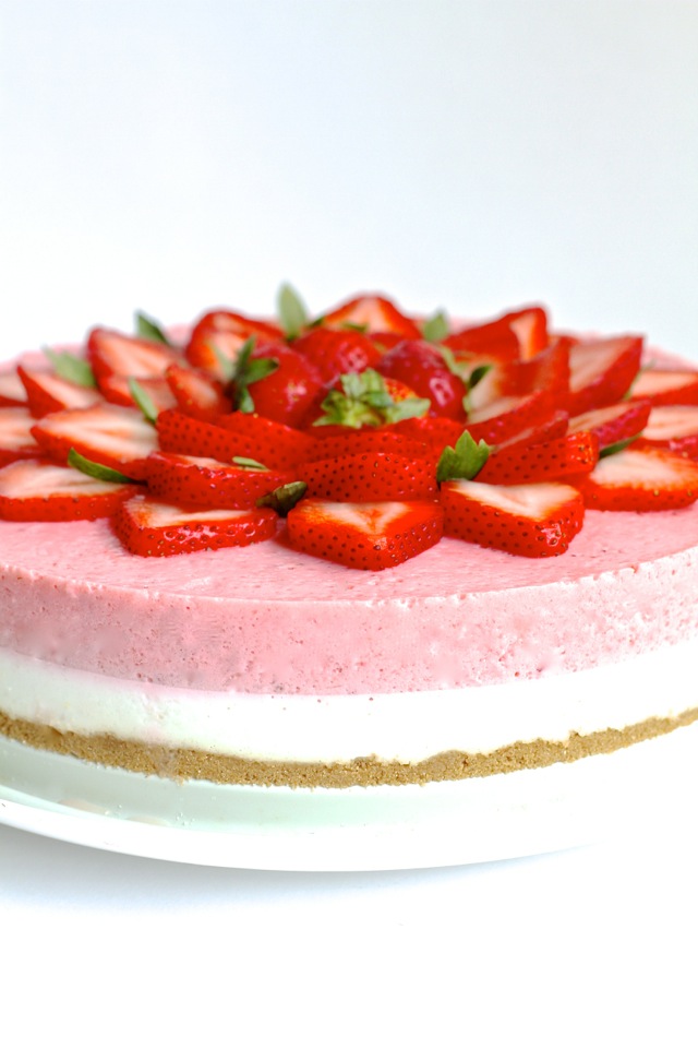 High in protein, low in fat, low in sugar, and roughly 150 calories per slice -- this No Bake Strawberry Cheesecake makes a perfect cool and creamy summer treat! || runningwithspoons.com