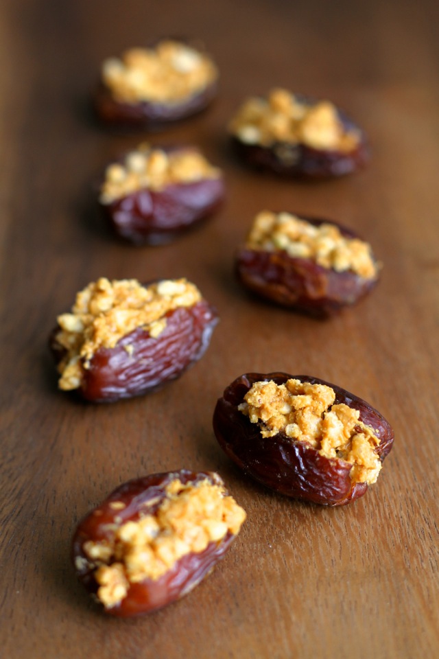 A crispy nutty filling stuffed into a sweet and gooey shell -- these Rice Krispie Stuffed Dates are a perfect way to satisfy that sweet tooth! || runningwithspoons.com