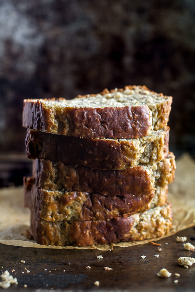 Greek Yogurt Banana Oat Bread - so soft and tender that you'd never be able to tell it's made without any butter or oil. This recipe is a great healthier alternative to a traditional favourite | runningwithspoons.com