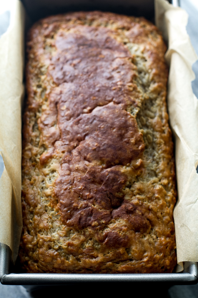 Greek Yogurt Banana Oat Bread - so soft and tender that you'd never be able to tell it's made without any butter or oil. This recipe is a great healthier alternative to a traditional favourite | runningwithspoons.com