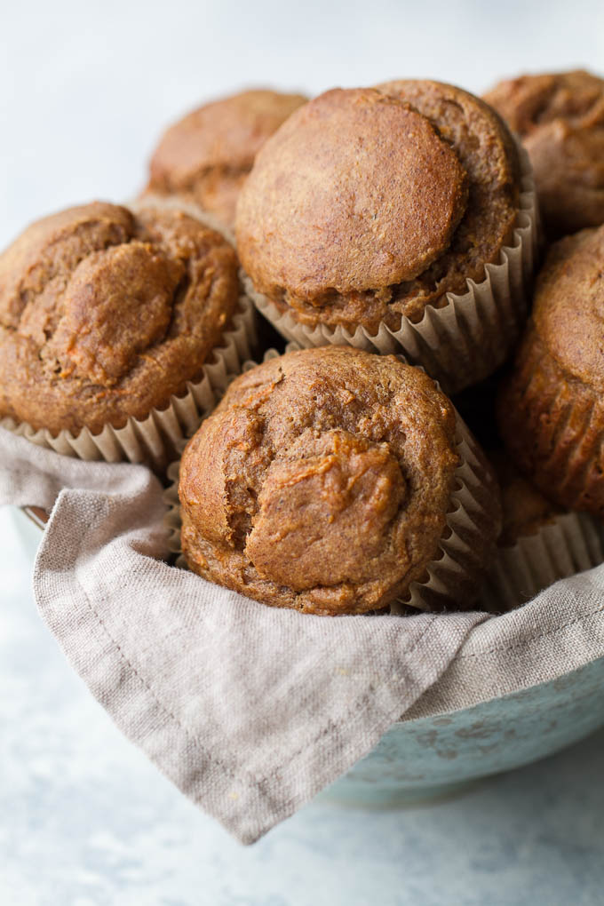 Flourless banana carrot muffins that are so tender and flavourful, you’d never know they were made without flour, oil, or refined sugar. Gluten free and made with wholesome ingredients, they make a healthy and delicious breakfast or snack | runningwithspoons.com #glutenfree #healthy #recipe