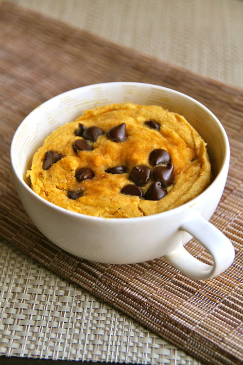 Chocolate Chip Pumpkin Mug Cake -- soft, fluffy, and crazy delicious! Whip up this gluten-free mug cake in under 5 minutes for a healthy and delicious treat! || runningwithspoons.com #pumpkin #fall