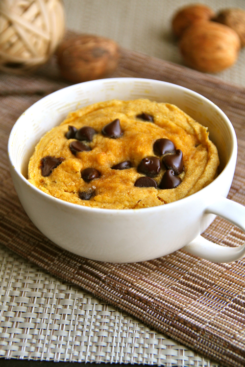Chocolate Chip Pumpkin Mug Cake -- soft, fluffy, and crazy delicious! Whip up this gluten-free mug cake in under 5 minutes for a healthy and delicious treat! || runningwithspoons.com #pumpkin #fall
