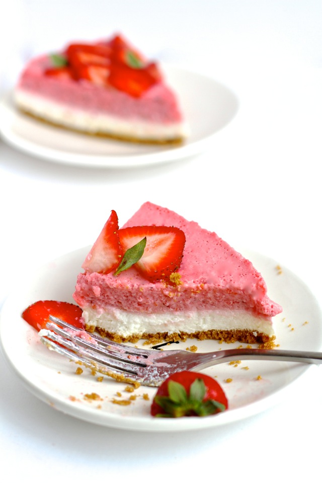 High in protein, low in fat, low in sugar, and roughly 150 calories per slice -- this No Bake Strawberry Cheesecake makes a perfect cool and creamy summer treat! || runningwithspoons.com