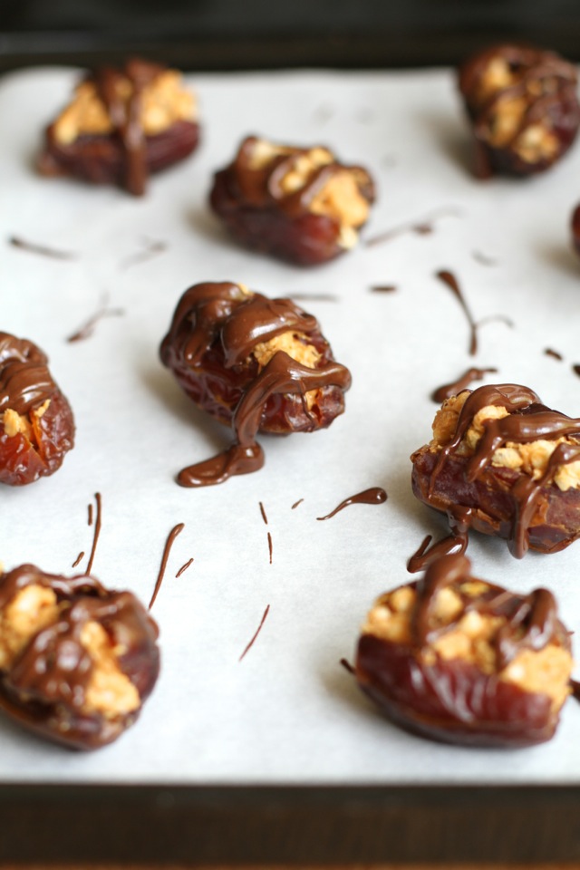 A crispy nutty filling stuffed into a sweet and gooey shell -- these Rice Krispie Stuffed Dates are a perfect way to satisfy that sweet tooth! || runningwithspoons.com