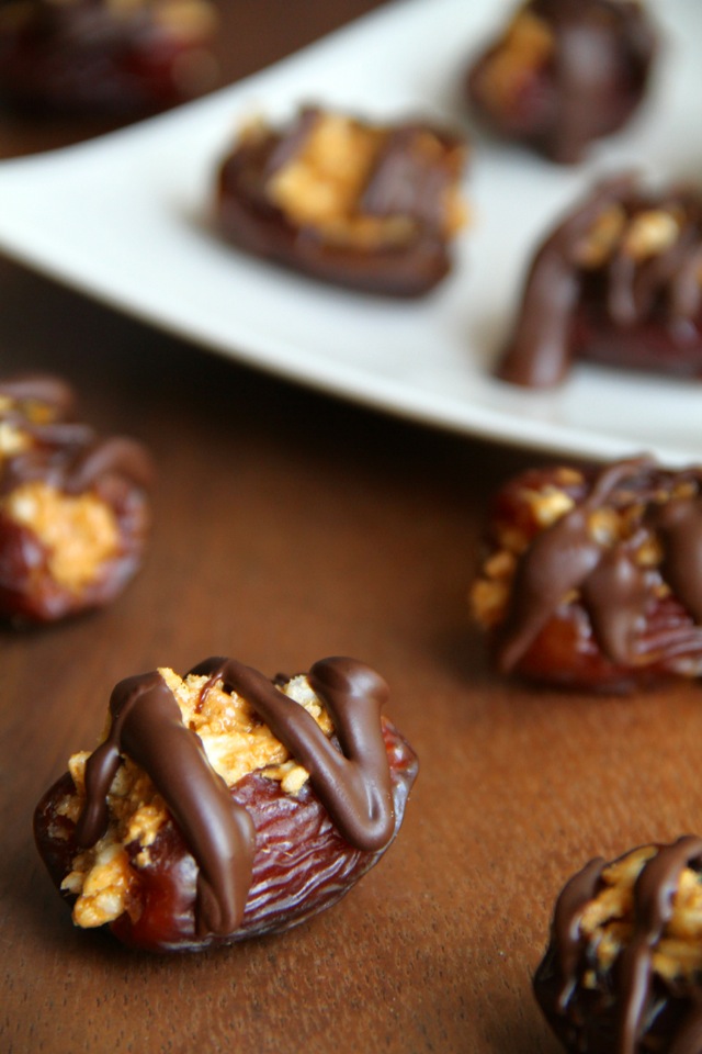 A crispy nutty filling stuffed into a sweet and gooey shell -- these Rice Krispie Stuffed Dates are a perfect way to satisfy that sweet tooth! || runningwithspoons.com