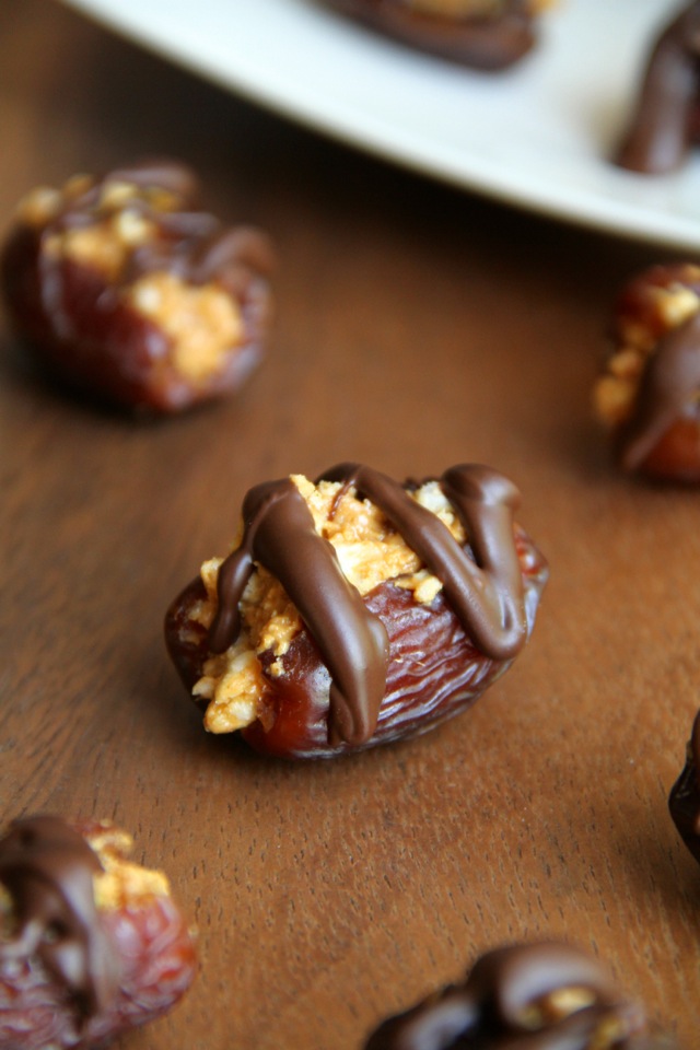 A crispy nutty filling stuffed into a sweet and gooey shell -- these Rice Krispie Stuffed Dates are a perfect way to satisfy that sweet tooth! || runningwithspoons.com