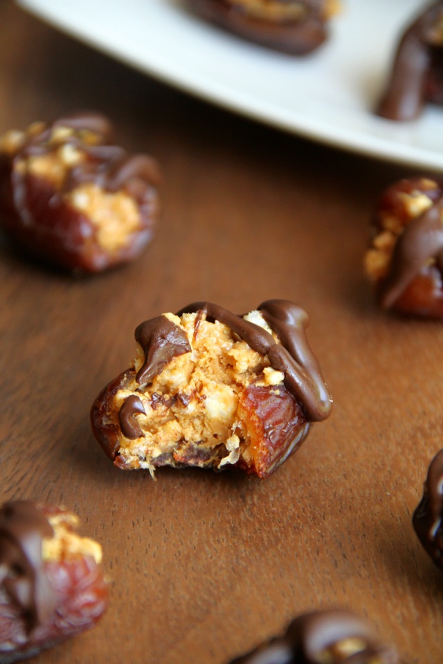 A crispy nutty filling stuffed into a sweet and gooey shell -- these Rice Krispie Stuffed Dates are a perfect way to satisfy that sweet tooth! || runningwithspoons.com
