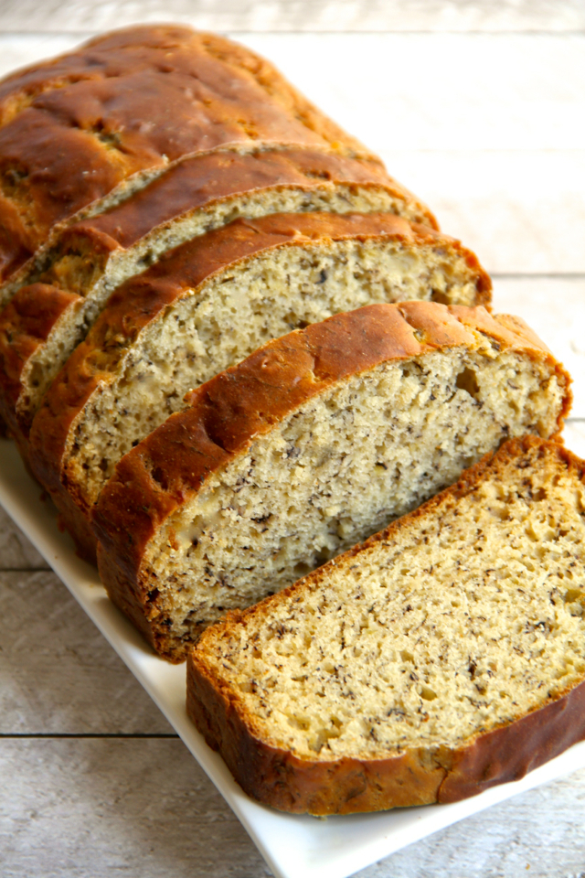 Greek Yogurt Banana Bread -- so soft and tender that you'd never be able to tell it's made without butter or oil! DELICIOUS! || runningwithspoons.com