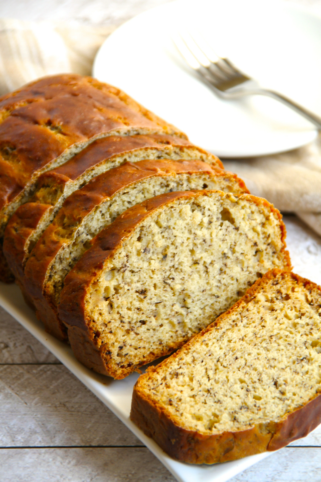 Slices of Greek yogurt banana bread on a square plate.