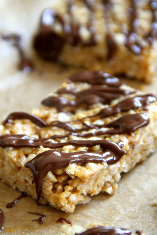 Protein Rice Krispie Treats -- a grown-up twist on a classic childhood favourite! Made without butter or marshmallows, these healthy bars are vegan, gluten-free, refined sugar-free, and make a great balanced snack! || runningwithspoons.com