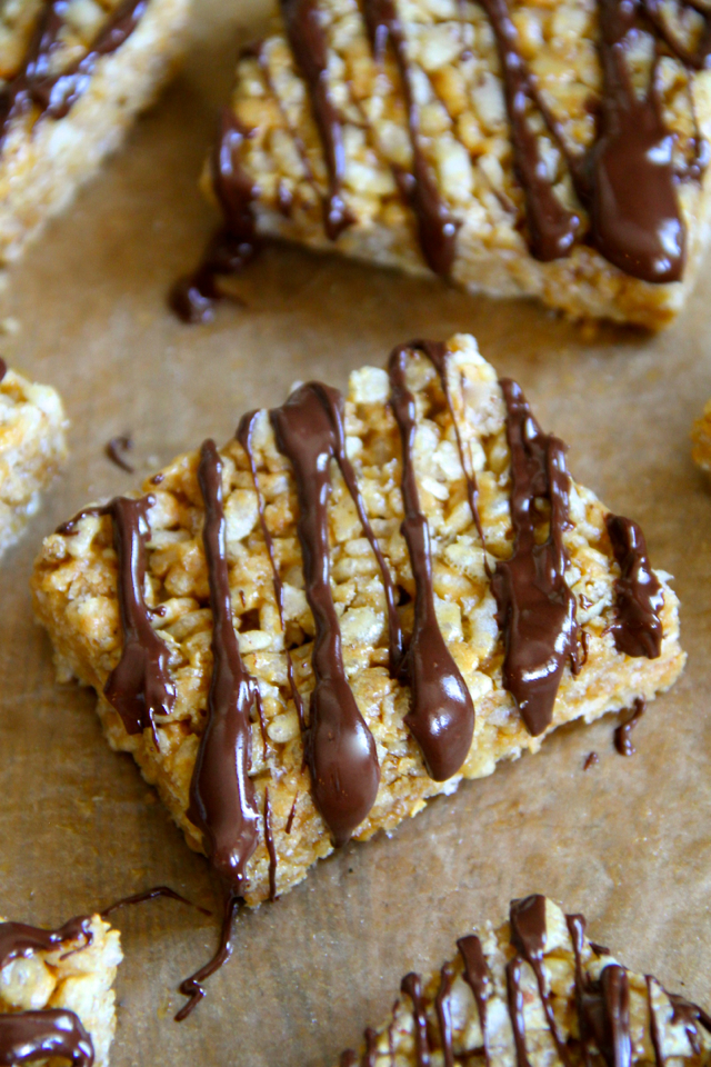 Protein Rice Krispie Treats -- a grown-up twist on a classic childhood favourite! Made without butter or marshmallows, these healthy bars are vegan, gluten-free, refined sugar-free, and make a great balanced snack! || runningwithspoons.com