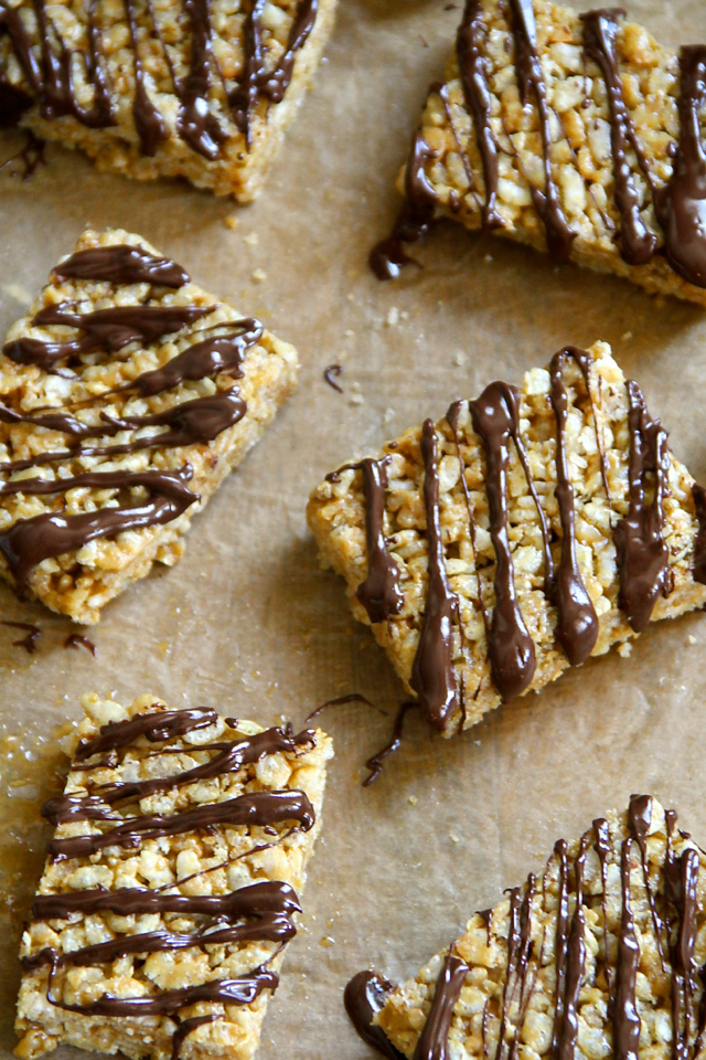 Protein Rice Krispie Treats -- a grown-up twist on a classic childhood favourite! Made without butter or marshmallows, these healthy bars are vegan, gluten-free, refined sugar-free, and make a great balanced snack! || runningwithspoons.com