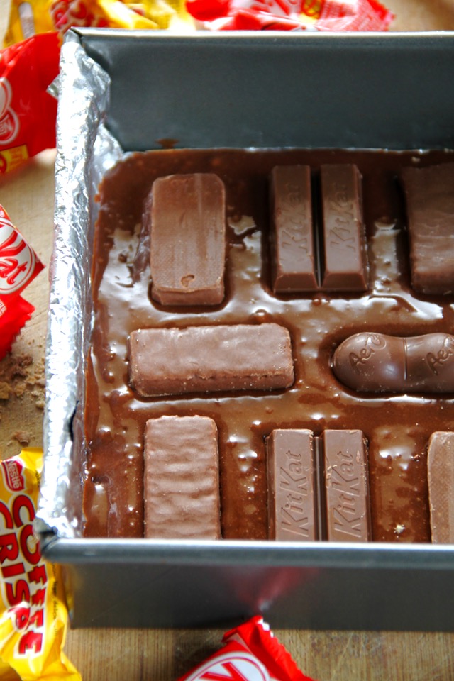 Soft, fudgy, and LOADED with chocolate, these Flourless Candy Bar Brownies are a great way to use up that leftover Halloween, Christmas, or Easter candy! The perfect dessert for any chocolate lover. || runningwithspoons.com #chocolate #brownies #candy #dessert