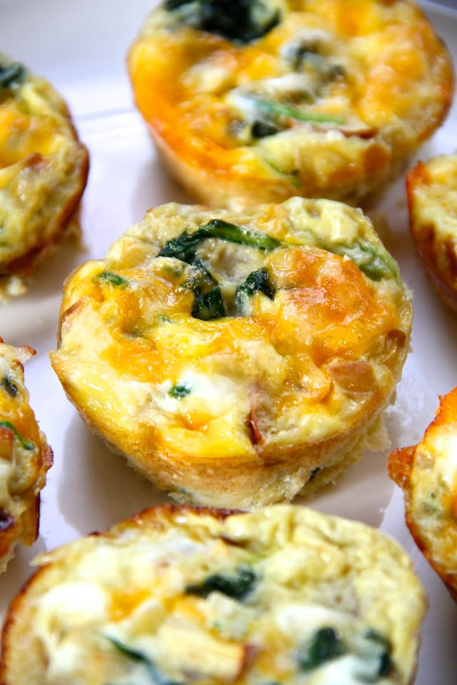 Apple and Gouda Mini Frittatas -- these delicious little egg muffins make a perfect grab-and-go breakfast or a fun brunch! Make ahead and simply pop them in the microwave when you're ready to eat || runningwithspoons.com #breakfast #brunch #eggs