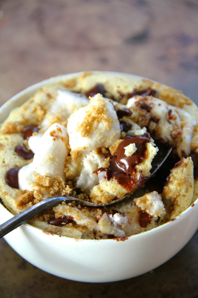 S'mores Mug Cake -- No campfire? no problem! Satisfy your s'mores craving with this soft and doughy campfire-free mug cake. Quick, easy, and made without butter or oil, it makes a perfect single-serve snack! || runningwithspoons.com #s'mores #mugcake #snack