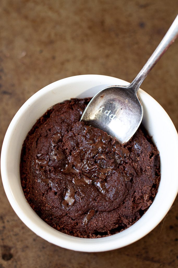 A healthy two minute brownie with chocolate chips melted on top.