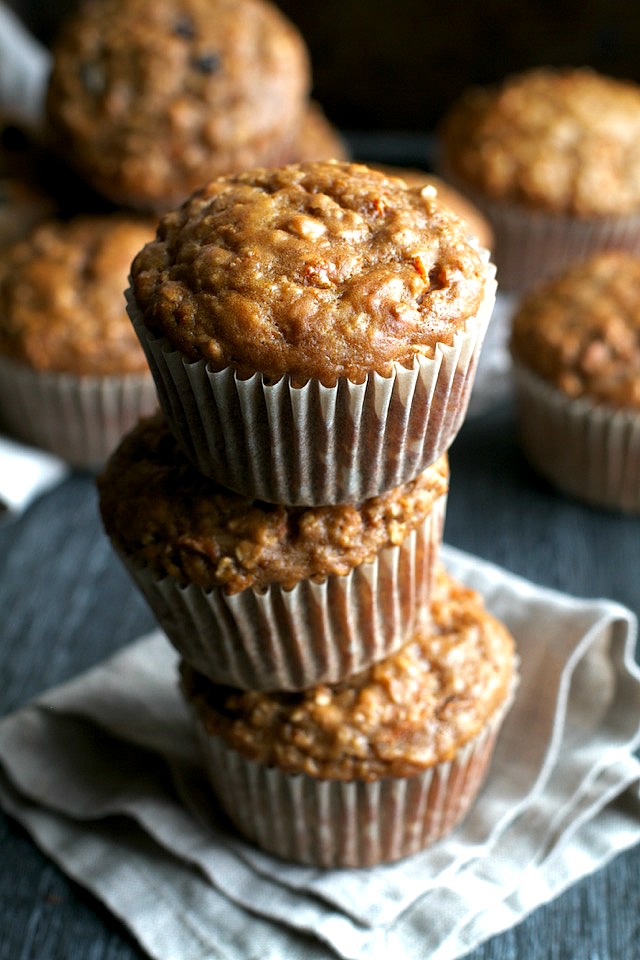 You won't find any butter or oil in these ridiculously soft and tender Carrot Oatmeal Greek Yogurt Muffins! What you will find is plenty of naturally sweetened, carrot-y goodness in each bite! | runningwithspoons.com #healthy #muffins #breakfast #snack