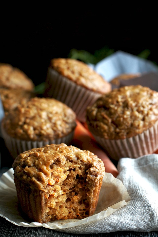 You won't find any butter or oil in these ridiculously soft and tender Carrot Oatmeal Greek Yogurt Muffins! What you will find is plenty of naturally sweetened, carrot-y goodness in each bite! | runningwithspoons.com #healthy #muffins #breakfast #snack