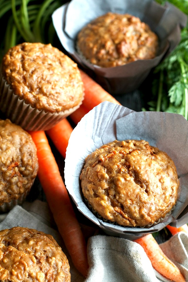 You won't find any butter or oil in these ridiculously soft and tender Carrot Oatmeal Greek Yogurt Muffins! What you will find is plenty of naturally sweetened, carrot-y goodness in each bite! | runningwithspoons.com #healthy #muffins #breakfast #snack