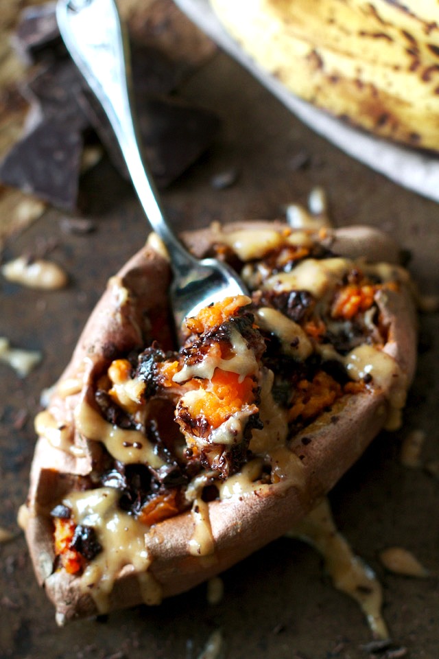 These Chunky Monkey Stuffed Sweet Potatoes are loaded with gooey caramelized bananas and melted dark chocolate before being topped with a creamy banana nut sauce. An irresistibly delicious gluten free and vegan treat! | runningwithspoons.com #recipe #healthy #sweetpotatoes #vegan