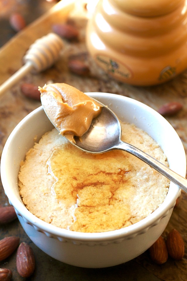 This healthy Honey Almond Oatmeal Mug Cake is made with NO flour, butter, or oil, but so soft and fluffy that you'd never be able to tell! | runningwithspoons.com #recipe #glutenfree #dessert