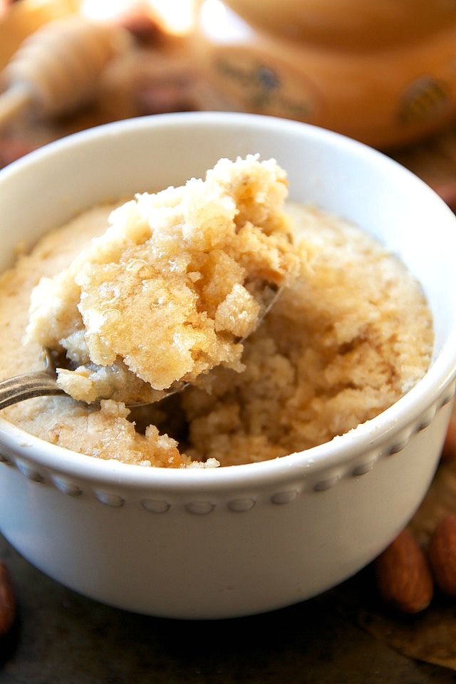 This healthy Honey Almond Oatmeal Mug Cake is made with NO flour, butter, or oil, but so soft and fluffy that you'd never be able to tell! | runningwithspoons.com #recipe #glutenfree #dessert