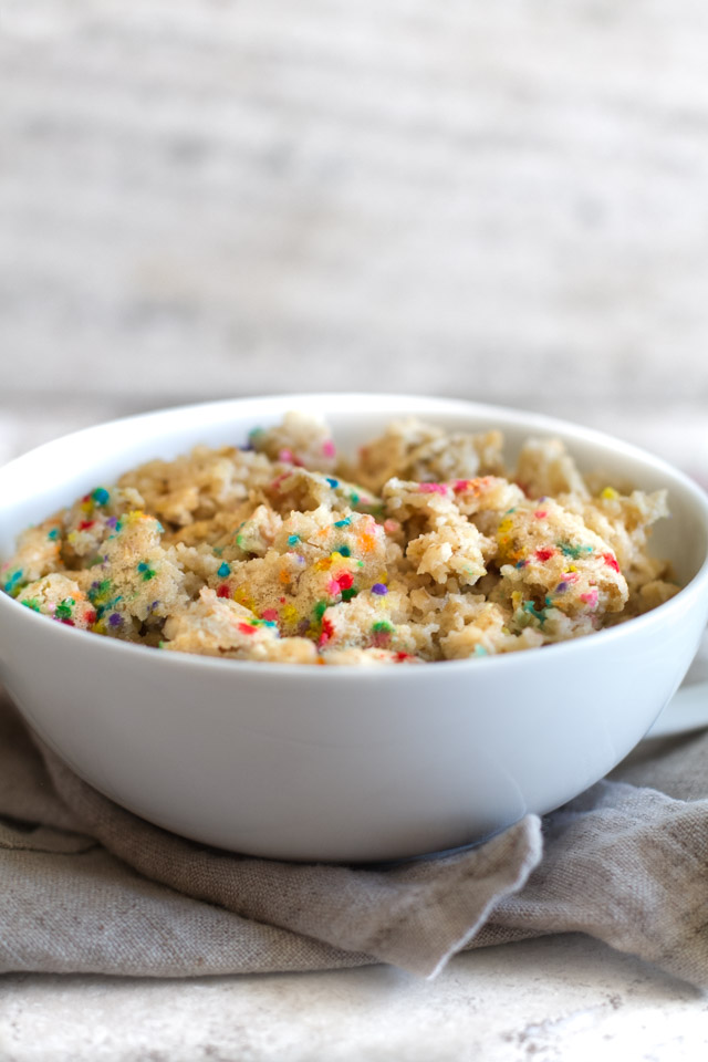 FUN and DELICIOUS! This healthy Funfetti Cake Batter Breakfast Bake tastes like dessert but is made without any flour, butter, oil, or refined sugar! Recipe via runningwithspoons.com #vegan #glutenfree #birthday