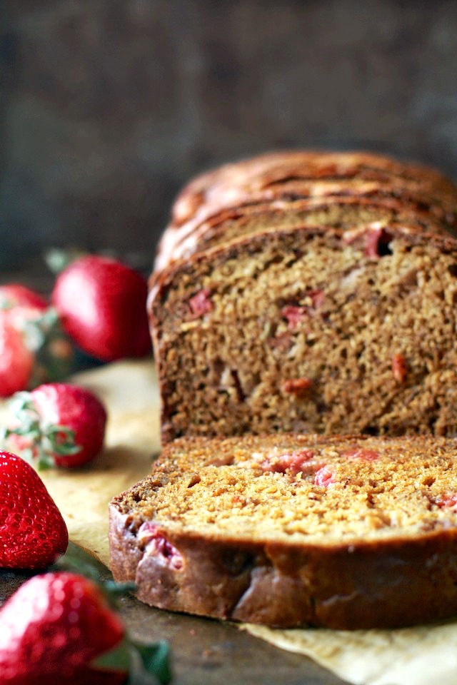 Strawberry Greek Yogurt Banana Bread -- soft, tender, and loaded with strawberries and banana in each bite! You'd never be able to tell it's made without butter or oil! | runningwithspoons.com #recipe #healthy