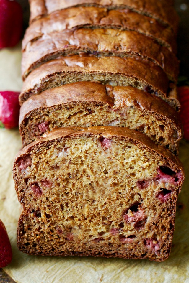 Strawberry Greek Yogurt Banana Bread -- soft, tender, and loaded with strawberries and banana in each bite! You'd never be able to tell it's made without butter or oil! | runningwithspoons.com #recipe #healthy
