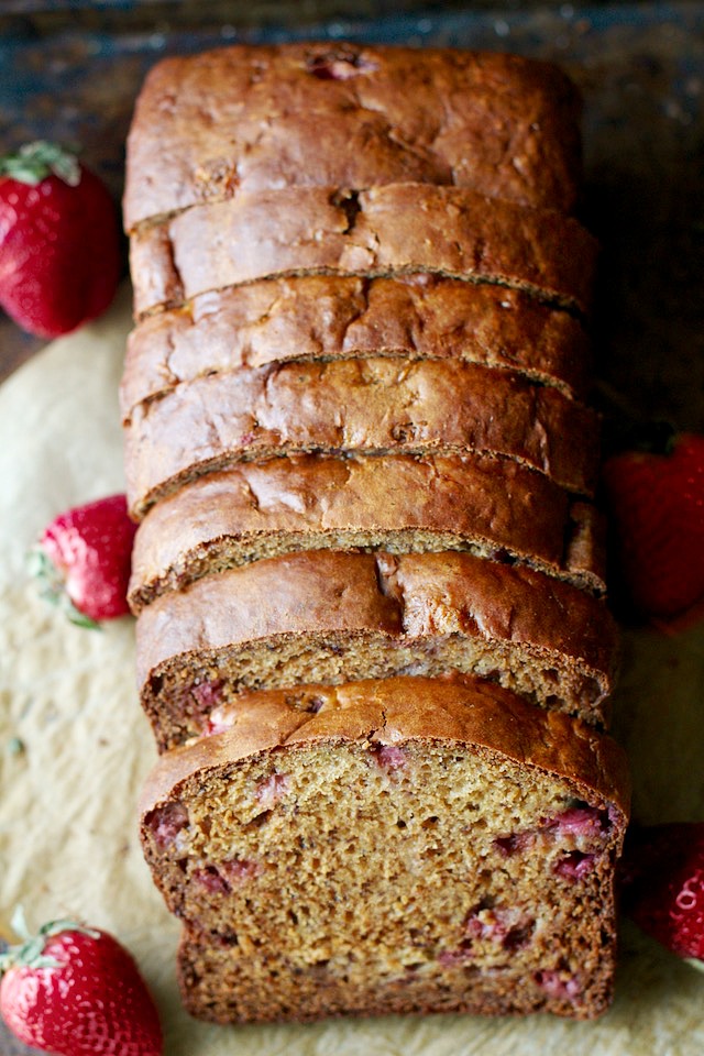 Strawberry Greek Yogurt Banana Bread -- soft, tender, and loaded with strawberries and banana in each bite! You'd never be able to tell it's made without butter or oil! | runningwithspoons.com #recipe #healthy