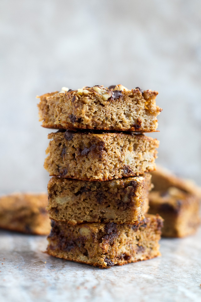 You won't find any flour, butter, or oil in these ridiculously soft and tender Flourless Banana Blondies! They're naturally gluten-free, and come out to less than 100 delicious calories per serving! | runningwithspoons.com #recipe #healthy #desserts