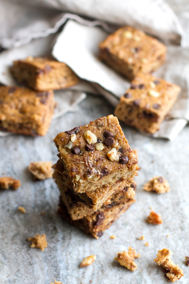 You won't find any flour, butter, or oil in these ridiculously soft and tender Flourless Banana Blondies! They're naturally gluten-free, and come out to less than 100 delicious calories per serving! | runningwithspoons.com #recipe #healthy #desserts