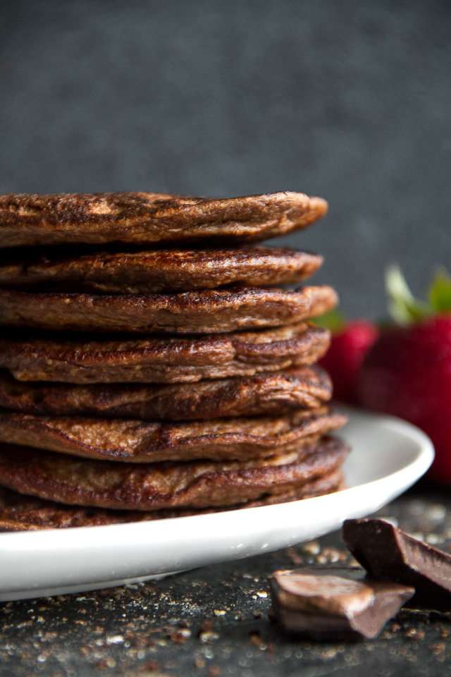 Healthy Double Chocolate Greek Yogurt Pancakes - light, fluffy, and loaded with chocolate flavour! These healthy blender pancakes will keep you satisfied all morning with over 26g of whole food protein. | runningwithspoons.com #recipe #glutenfree #breakfast