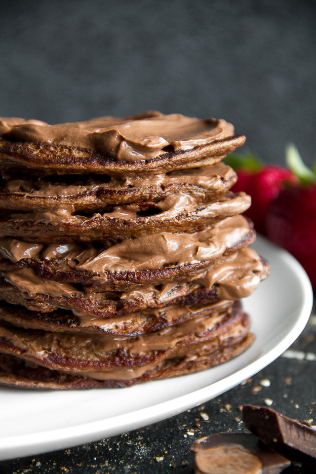 Healthy Double Chocolate Greek Yogurt Pancakes - light, fluffy, and loaded with chocolate flavour! These healthy blender pancakes will keep you satisfied all morning with over 26g of whole food protein. | runningwithspoons.com #recipe #glutenfree #breakfast