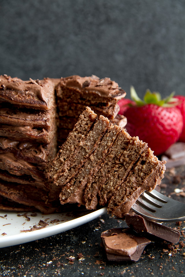 Healthy Double Chocolate Greek Yogurt Pancakes - light, fluffy, and loaded with chocolate flavour! These healthy blender pancakes will keep you satisfied all morning with over 26g of whole food protein. | runningwithspoons.com #recipe #glutenfree #breakfast