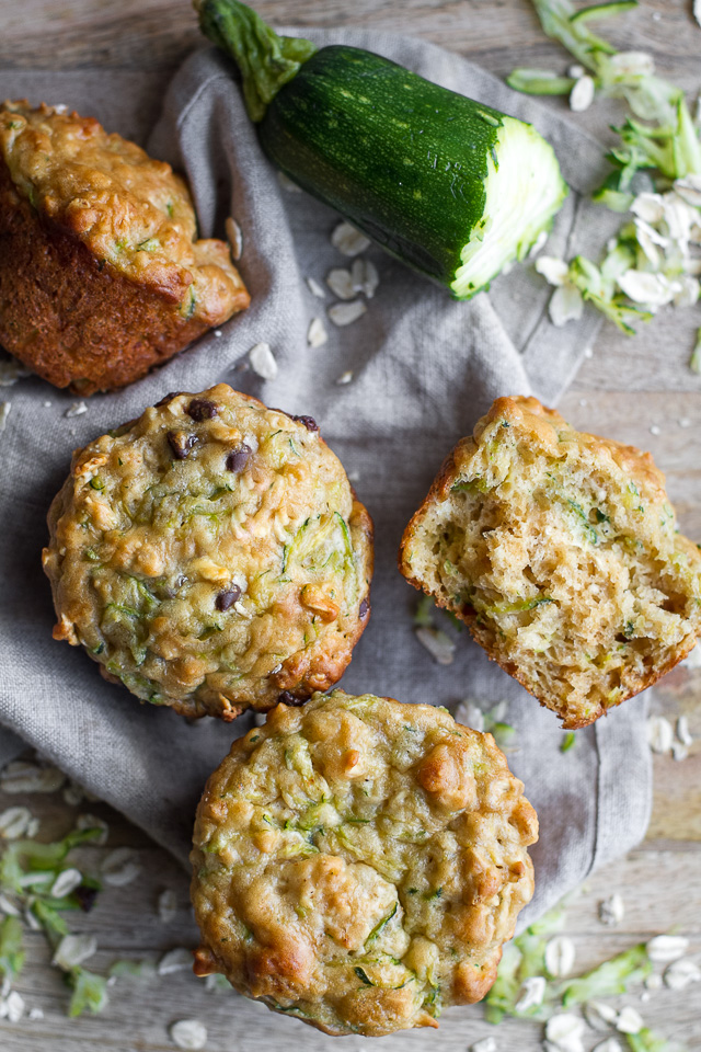 You won't find any butter or oil in these ridiculously soft and tender Zucchini Oat Greek Yogurt Muffins! They're naturally sweetened and perfect for breakfast or healthy snacking. | runningwithspoons.com #recipe #snack #summer