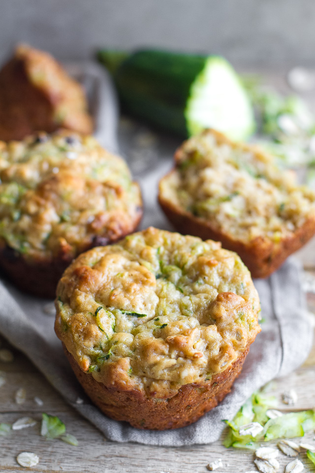 You won't find any butter or oil in these ridiculously soft and tender Zucchini Oat Greek Yogurt Muffins! They're naturally sweetened and perfect for breakfast or healthy snacking. | runningwithspoons.com #recipe #snack #summer