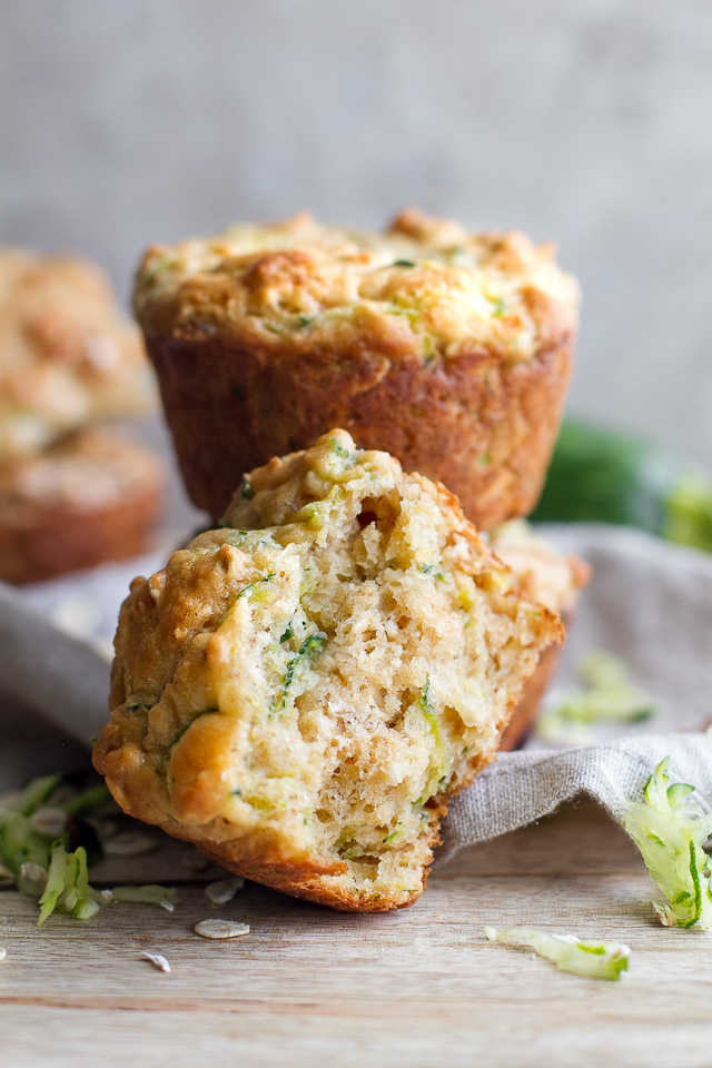 You won't find any butter or oil in these ridiculously soft and tender Zucchini Oat Greek Yogurt Muffins! They're naturally sweetened and perfect for breakfast or healthy snacking. | runningwithspoons.com #recipe #snack #summer