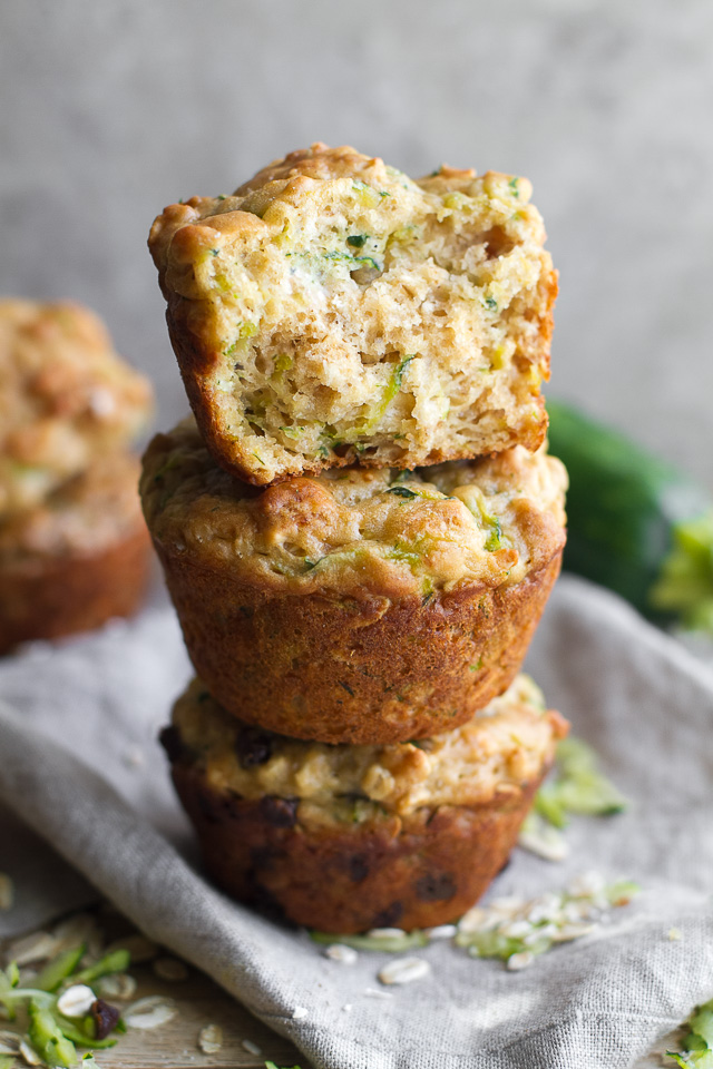 You won't find any butter or oil in these ridiculously soft and tender Zucchini Oat Greek Yogurt Muffins! They're naturally sweetened and perfect for breakfast or healthy snacking. | runningwithspoons.com #recipe #snack #summer