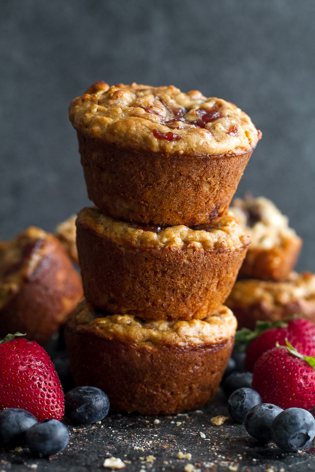 You won't find any butter or oil in these healthy Almond Butter & Jelly Muffins! The recipe calls for Greek yogurt to keep them soft and tender, with swirls of almond butter and jelly to add tonnes of flavour. | runningwithspoons.com