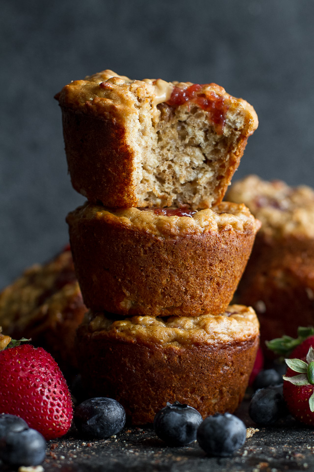 You won't find any butter or oil in these healthy Almond Butter & Jelly Muffins! The recipe calls for Greek yogurt to keep them soft and tender, with swirls of almond butter and jelly to add tonnes of flavour. | runningwithspoons.com
