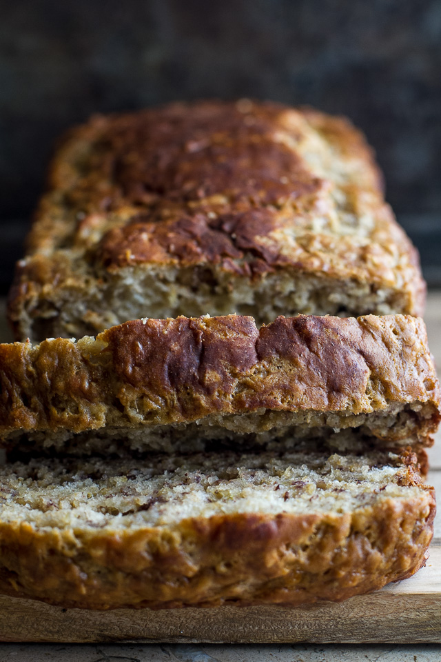 Greek Yogurt Banana Oat Bread - so soft and tender that you'd never be able to tell it's made without any butter or oil. This recipe is a great healthier alternative to a traditional favourite | runningwithspoons.com