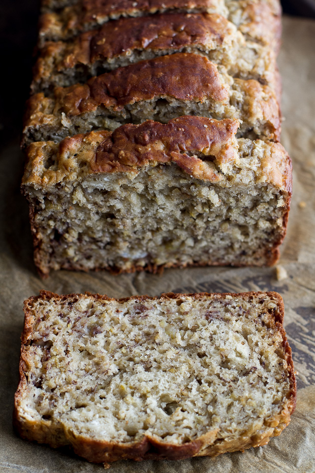 Greek Yogurt Banana Oat Bread - so soft and tender that you'd never be able to tell it's made without any butter or oil. This recipe is a great healthier alternative to a traditional favourite | runningwithspoons.com