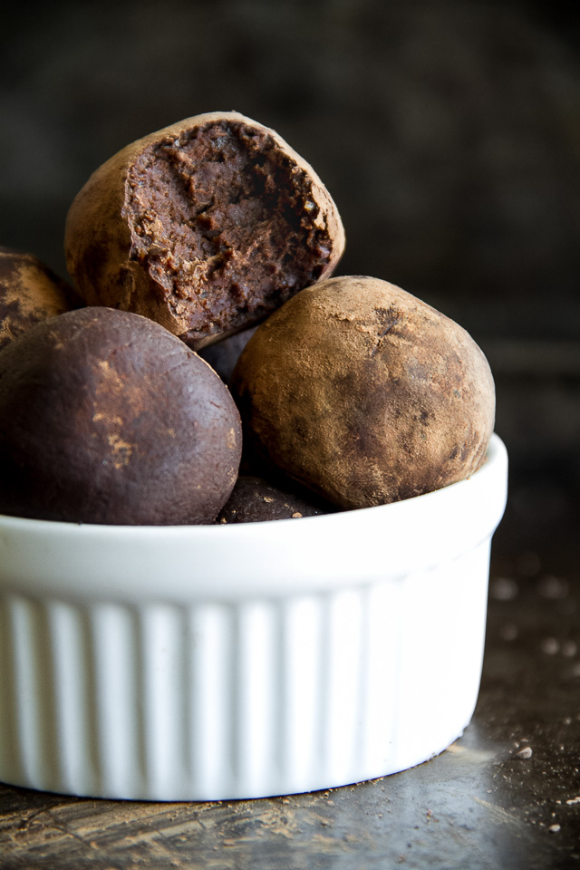 These melt-in-your-mouth No Bake Chocolate Fudge Protein Truffles taste SUPER decadent but are packed with good-for-you ingredients. They're a healthy way to satisfy those chocolate cravings and make a delicious pre or post-workout snack | runningwithspoons.com #recipe #vegan #glutenfree