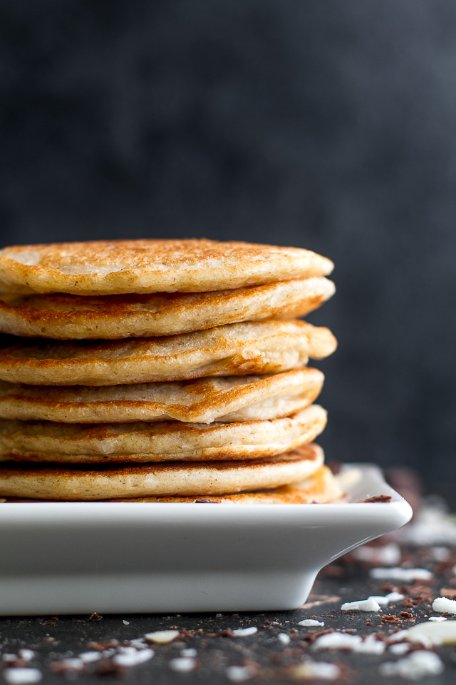 These healthy Almond Joy Greek Yogurt Pancakes are sure to keep you satisfied all morning with over 20g of whole food protein! | runningwithspoons.com