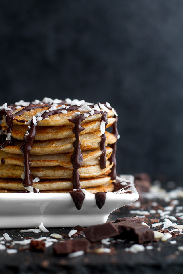 These healthy Almond Joy Greek Yogurt Pancakes are sure to keep you satisfied all morning with over 20g of whole food protein! | runningwithspoons.com