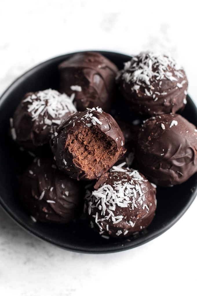 A small bowl of no bake brownie batter truffles.