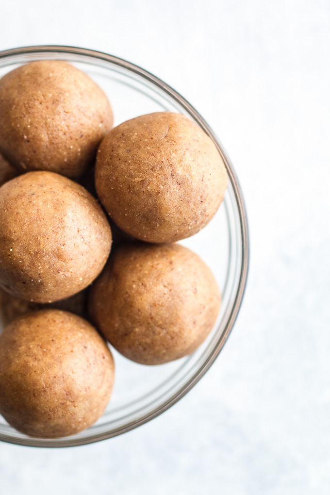 You won't miss the butter or sugar in these healthy buckeyes! They're made with wholesome ingredients like coconut flour and maple syrup, and make a delicious alternative to a traditional favourite! {gluten-free, vegan, paleo} | runningwithspoons.com