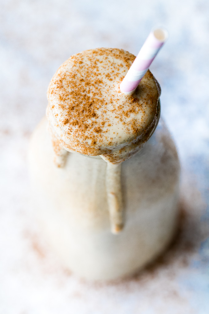 This caramel apple protein smoothie is going to become your favourite way to enjoy an apple a day! It's super creamy, packed with protein, and guaranteed to keep you satisfied all morning! | runningwithspoons.com
